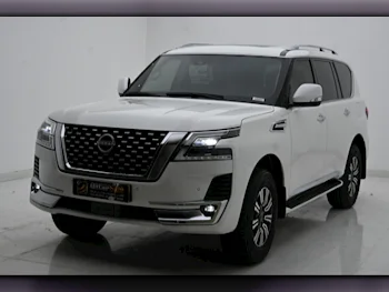 Nissan  Patrol  Titanium  2023  Automatic  7,300 Km  6 Cylinder  Four Wheel Drive (4WD)  SUV  White  With Warranty