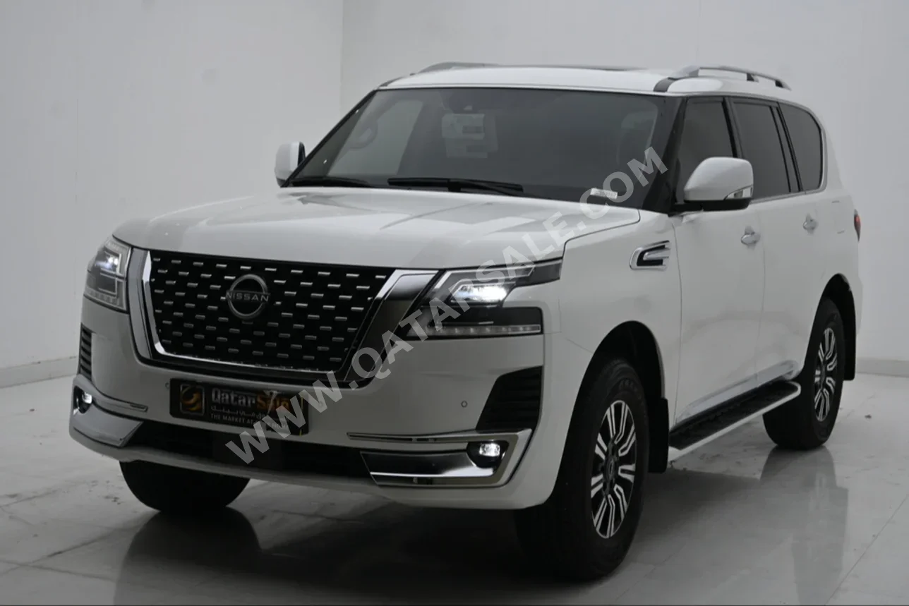 Nissan  Patrol  Titanium  2023  Automatic  7,300 Km  6 Cylinder  Four Wheel Drive (4WD)  SUV  White  With Warranty