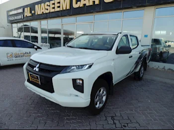 Mitsubishi  L 200  2023  Manual  3,000 Km  4 Cylinder  Rear Wheel Drive (RWD)  Pick Up  White  With Warranty