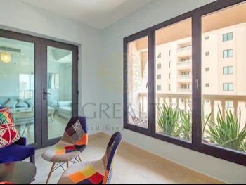 2 Bedrooms  Apartment  For Rent  in Doha -  The Pearl  Fully Furnished