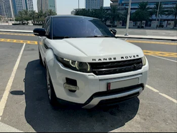Land Rover  Evoque  R-Dynamic  2013  Automatic  85,574 Km  4 Cylinder  All Wheel Drive (AWD)  Hatchback  White
