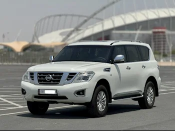 Nissan  Patrol  SE  2015  Automatic  392٬000 Km  8 Cylinder  Four Wheel Drive (4WD)  SUV  White