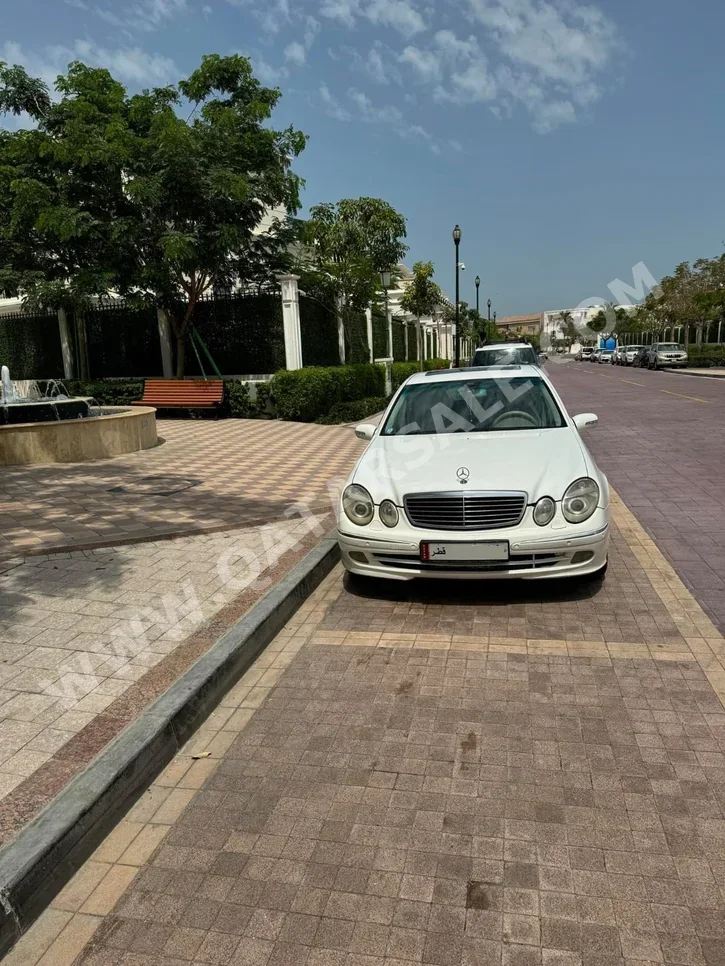 Mercedes-Benz  E-Class  240  2004  Automatic  120,000 Km  4 Cylinder  All Wheel Drive (AWD)  Sedan  White