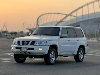 Nissan  Patrol  Safari  2021  Manual  35,000 Km  6 Cylinder  Four Wheel Drive (4WD)  SUV  White  With Warranty