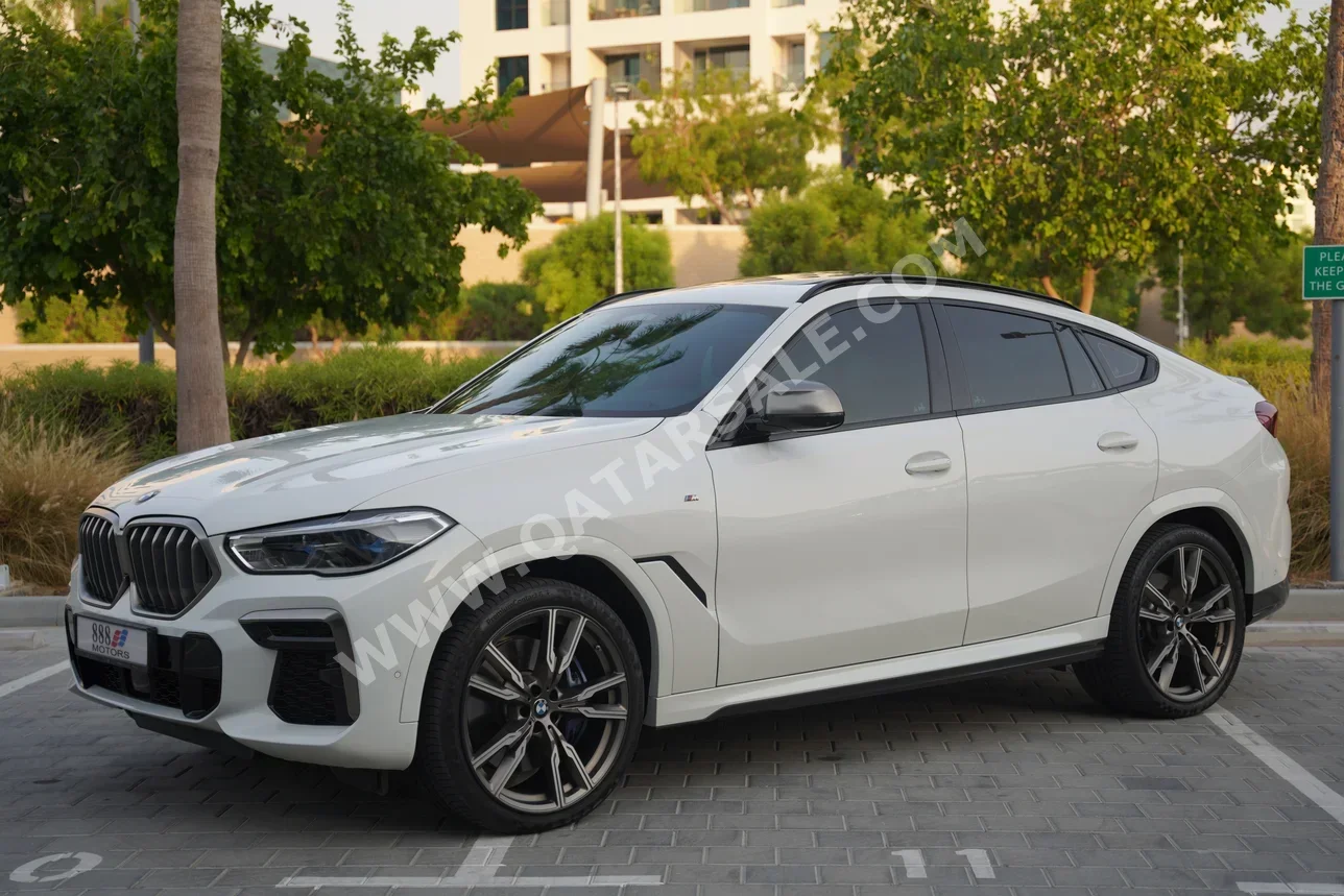 BMW  X-Series  X6 M50i  2022  Automatic  57٬000 Km  8 Cylinder  Four Wheel Drive (4WD)  SUV  White  With Warranty