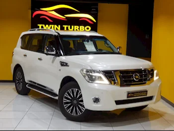 Nissan  Patrol  Platinum  2015  Automatic  159,000 Km  8 Cylinder  Four Wheel Drive (4WD)  SUV  White