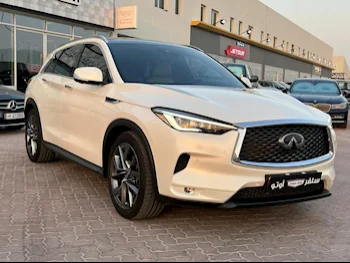 Infiniti  QX  50  2021  Automatic  32٬600 Km  4 Cylinder  Four Wheel Drive (4WD)  SUV  White  With Warranty