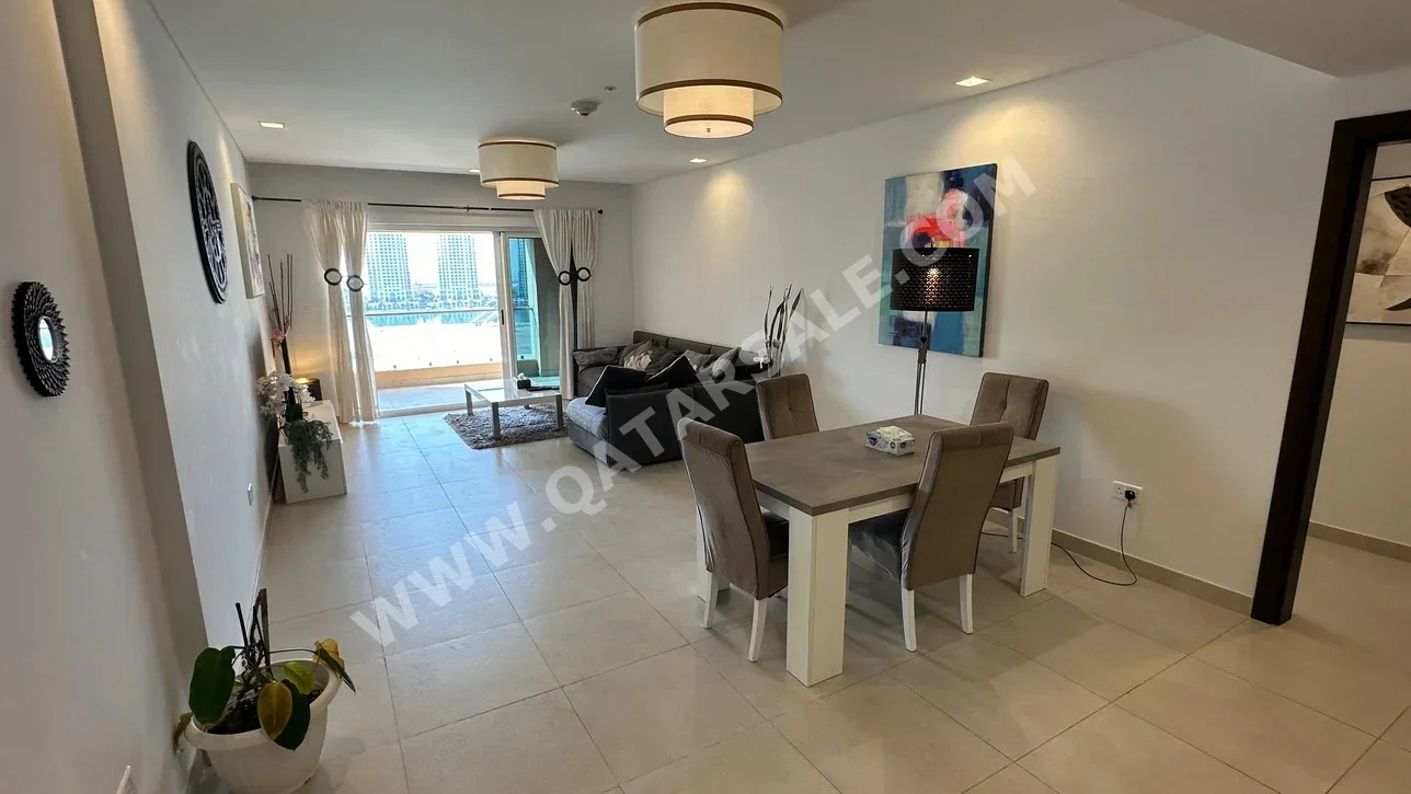 2 Bedrooms  Apartment  For Rent  in Doha -  The Pearl  Fully Furnished