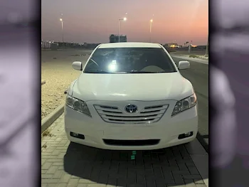 Toyota  Camry  GLX  2009  Automatic  65,000 Km  4 Cylinder  Front Wheel Drive (FWD)  Sedan  White  With Warranty