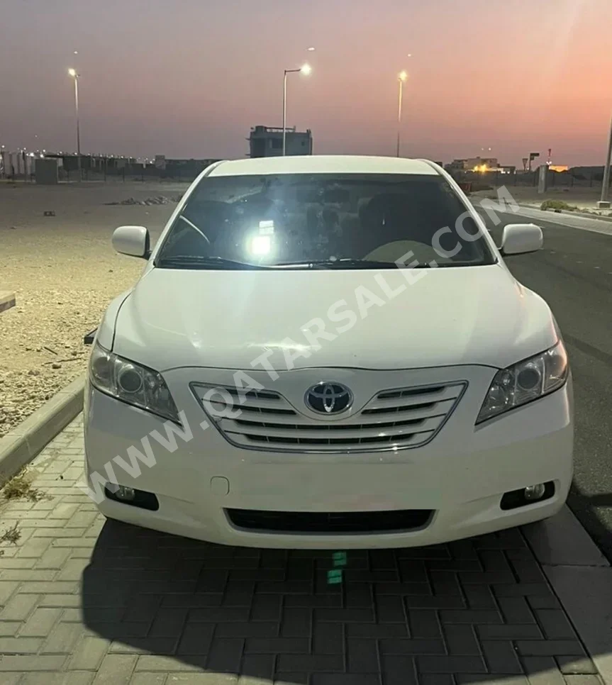 Toyota  Camry  GLX  2009  Automatic  65,000 Km  4 Cylinder  Front Wheel Drive (FWD)  Sedan  White  With Warranty