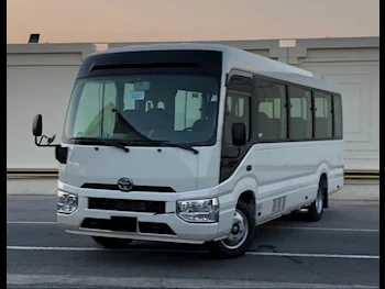 Toyota  Coaster  2024  Manual  0 Km  4 Cylinder  Rear Wheel Drive (RWD)  Van / Bus  White  With Warranty