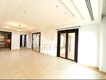 2 Bedrooms  Apartment  For Rent  in Doha -  The Pearl  Not Furnished