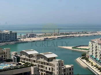 2 Bedrooms  Apartment  For Rent  in Doha -  The Pearl  Not Furnished