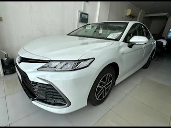 Toyota  Camry  Hybrid  2024  Automatic  0 Km  4 Cylinder  Front Wheel Drive (FWD)  Sedan  White  With Warranty