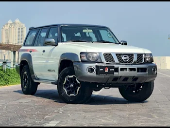 Nissan  Patrol  Super Safari  2021  Automatic  59,000 Km  6 Cylinder  Four Wheel Drive (4WD)  SUV  White