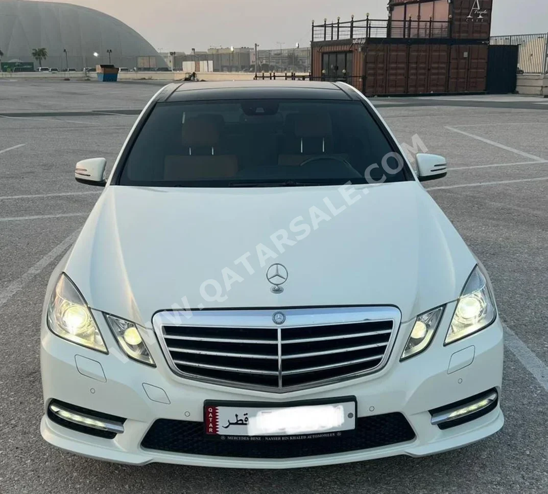 Mercedes-Benz  E-Class  300  2012  Automatic  20,000 Km  6 Cylinder  Rear Wheel Drive (RWD)  Sedan  White