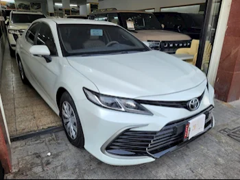 Toyota  Camry  LE  2022  Automatic  12,000 Km  4 Cylinder  Front Wheel Drive (FWD)  Sedan  White  With Warranty