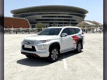 Mitsubishi  Pajero  Montero Sport  2023  Automatic  9,394 Km  6 Cylinder  All Wheel Drive (AWD)  SUV  White  With Warranty