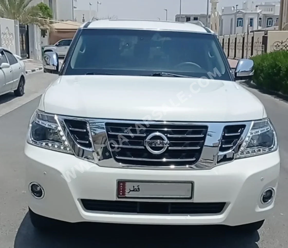 Nissan  Patrol  2012  Automatic  207,000 Km  8 Cylinder  Four Wheel Drive (4WD)  SUV  White  With Warranty