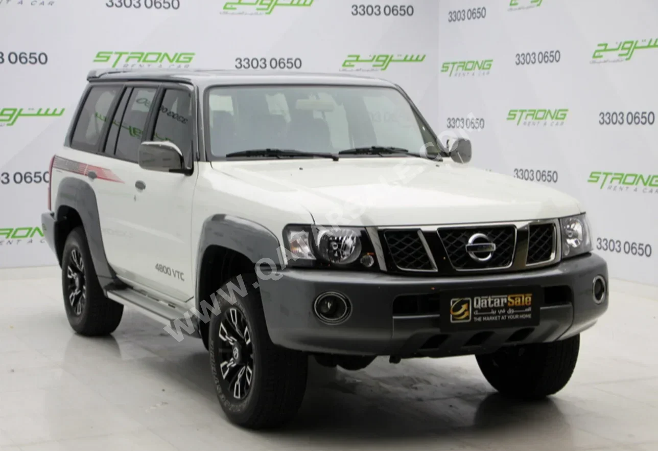  Nissan  Patrol  Super Safari  2023  Manual  9,000 Km  6 Cylinder  Four Wheel Drive (4WD)  SUV  Pearl  With Warranty