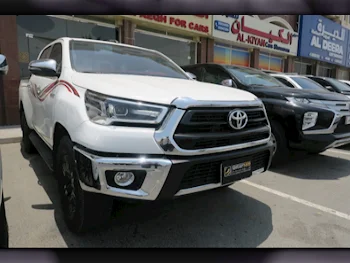 Toyota  Hilux  2021  Automatic  88,000 Km  4 Cylinder  Four Wheel Drive (4WD)  Pick Up  White