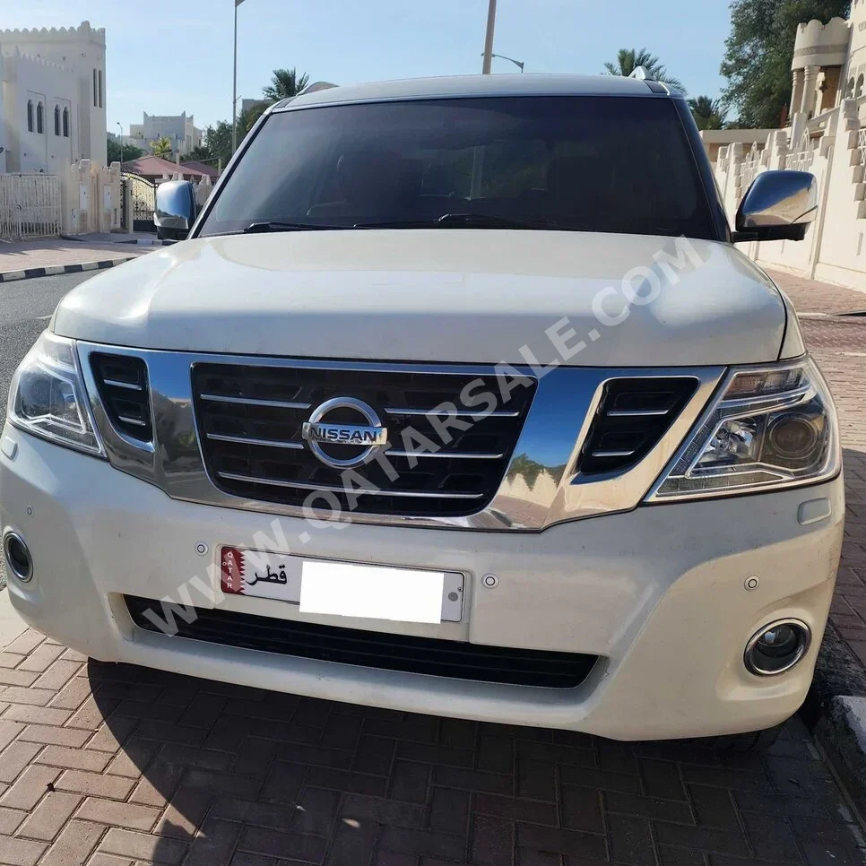 Nissan  Patrol  Platinum  2015  Automatic  156,000 Km  8 Cylinder  Four Wheel Drive (4WD)  SUV  White