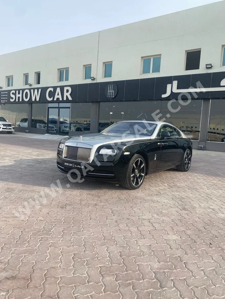 Rolls-Royce  Wraith  2015  Automatic  54٬000 Km  12 Cylinder  All Wheel Drive (AWD)  Coupe / Sport  Black and Silver