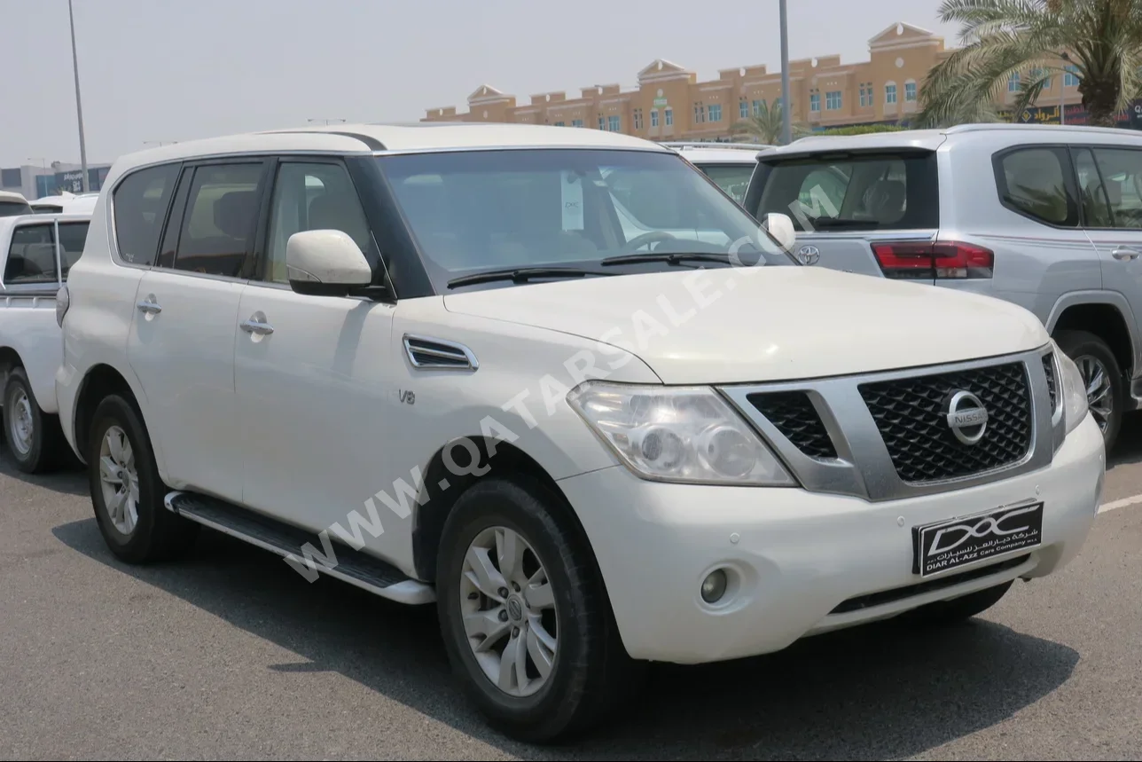 Nissan  Patrol  SE  2013  Automatic  414,000 Km  8 Cylinder  Four Wheel Drive (4WD)  SUV  White