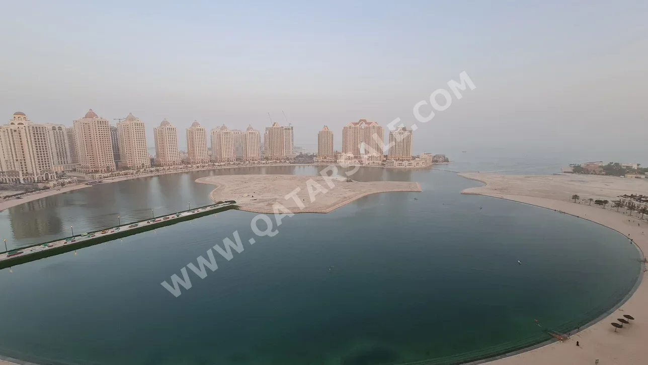 2 Bedrooms  Hotel apart  For Rent  in Doha -  The Pearl  Semi Furnished