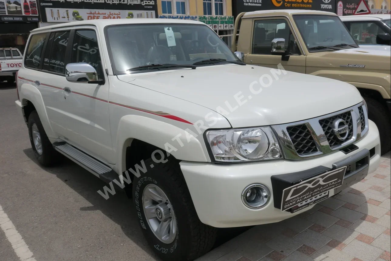 Nissan  Patrol  Safari  2023  Manual  0 Km  6 Cylinder  Four Wheel Drive (4WD)  SUV  White  With Warranty