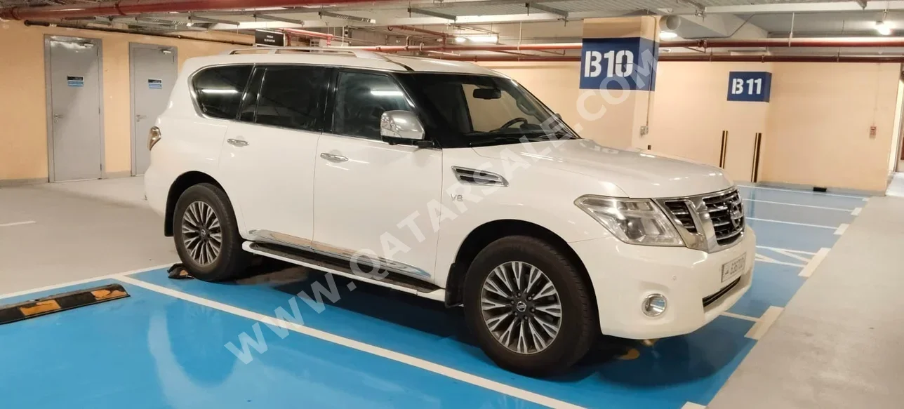 Nissan  Patrol  Platinum  2014  Automatic  297,000 Km  8 Cylinder  Four Wheel Drive (4WD)  SUV  White