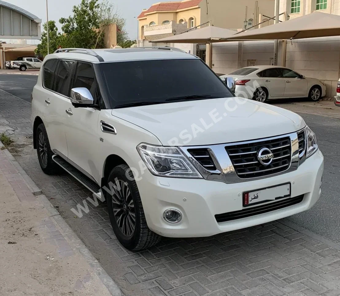 Nissan  Patrol  Platinum  2015  Automatic  198,000 Km  8 Cylinder  Four Wheel Drive (4WD)  SUV  White