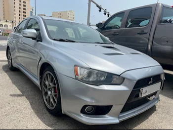 Mitsubishi  Lancer  Evolution  2010  Manual  150,000 Km  4 Cylinder  Four Wheel Drive (4WD)  Sedan  Silver