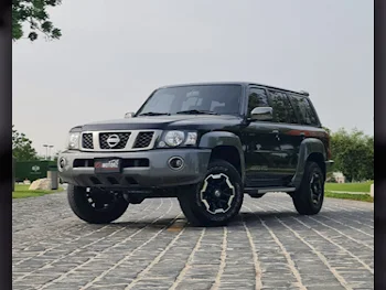  Nissan  Patrol  Super Safari  2022  Automatic  60,000 Km  6 Cylinder  Four Wheel Drive (4WD)  SUV  Black  With Warranty