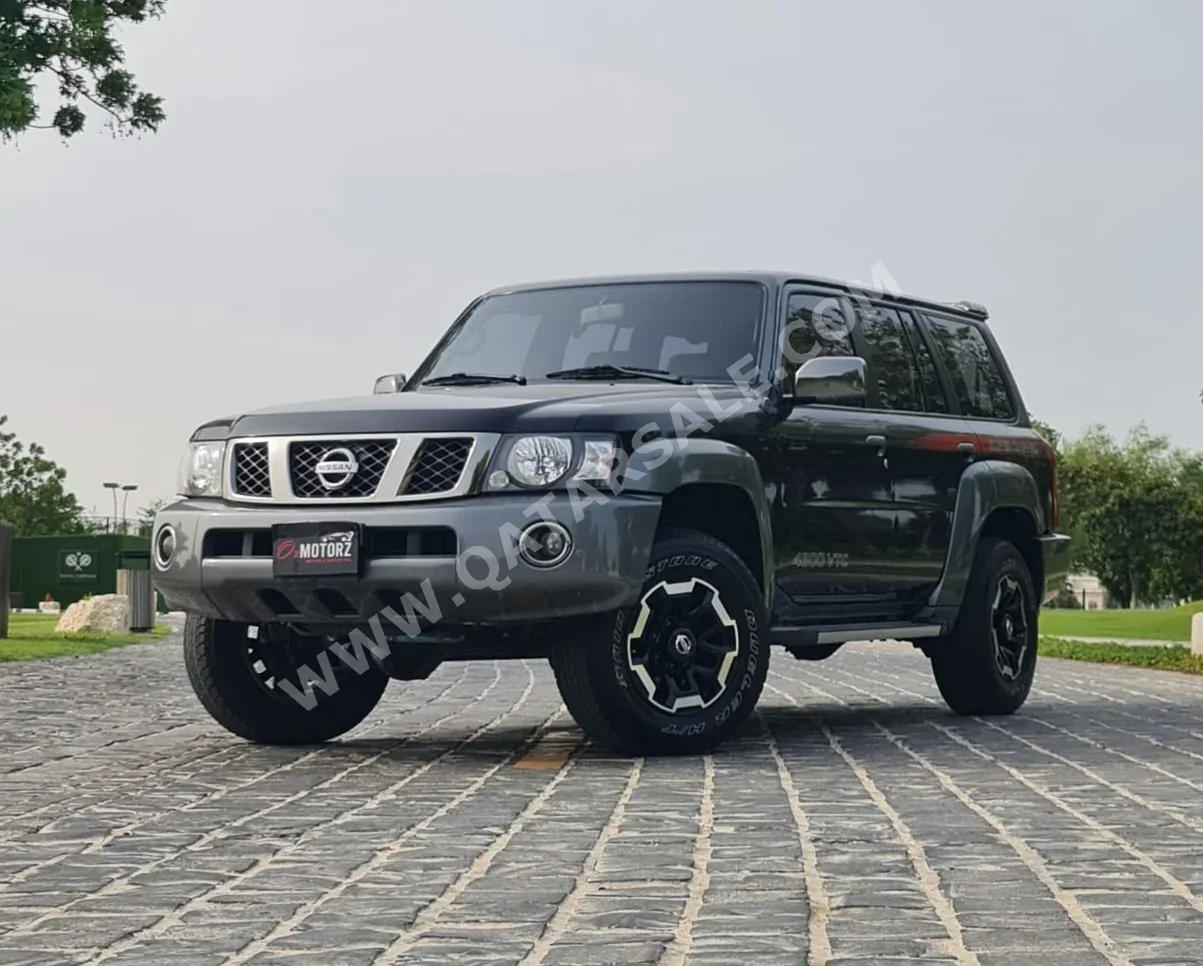  Nissan  Patrol  Super Safari  2022  Automatic  60,000 Km  6 Cylinder  Four Wheel Drive (4WD)  SUV  Black  With Warranty