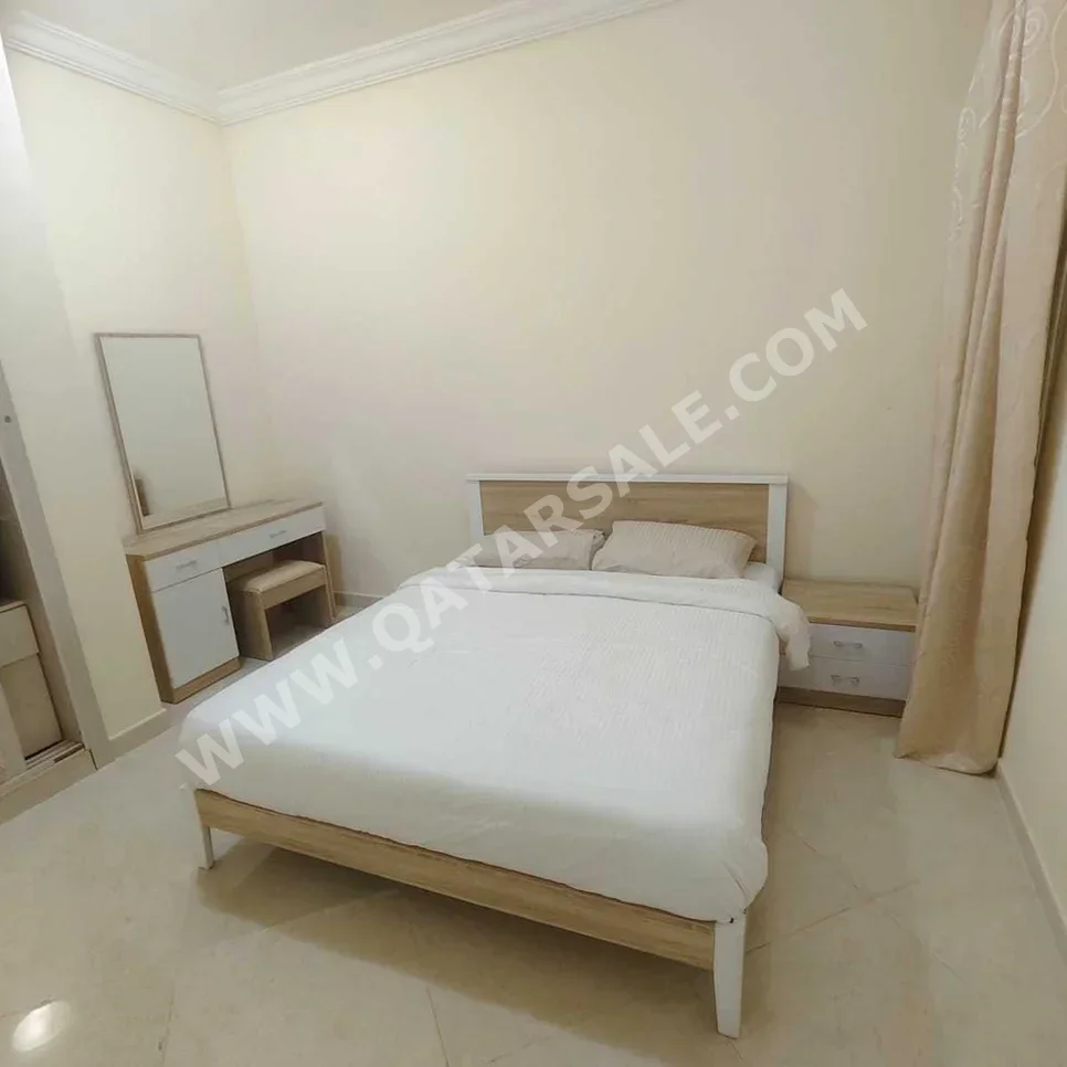 2 Bedrooms  Apartment  For Rent  in Doha -  Al Mansoura  Fully Furnished