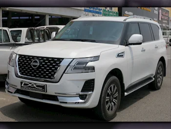 Nissan  Patrol  Titanium  2023  Automatic  32,000 Km  6 Cylinder  Four Wheel Drive (4WD)  SUV  White  With Warranty