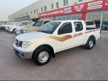 Nissan  Navara  SE  2014  Manual  363,000 Km  4 Cylinder  Rear Wheel Drive (RWD)  Pick Up  White