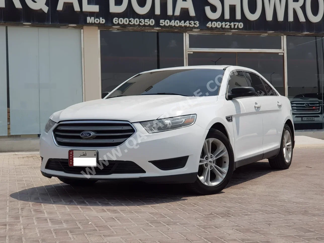 Ford  Taurus  2015  Automatic  131,000 Km  6 Cylinder  Rear Wheel Drive (RWD)  Sedan  White