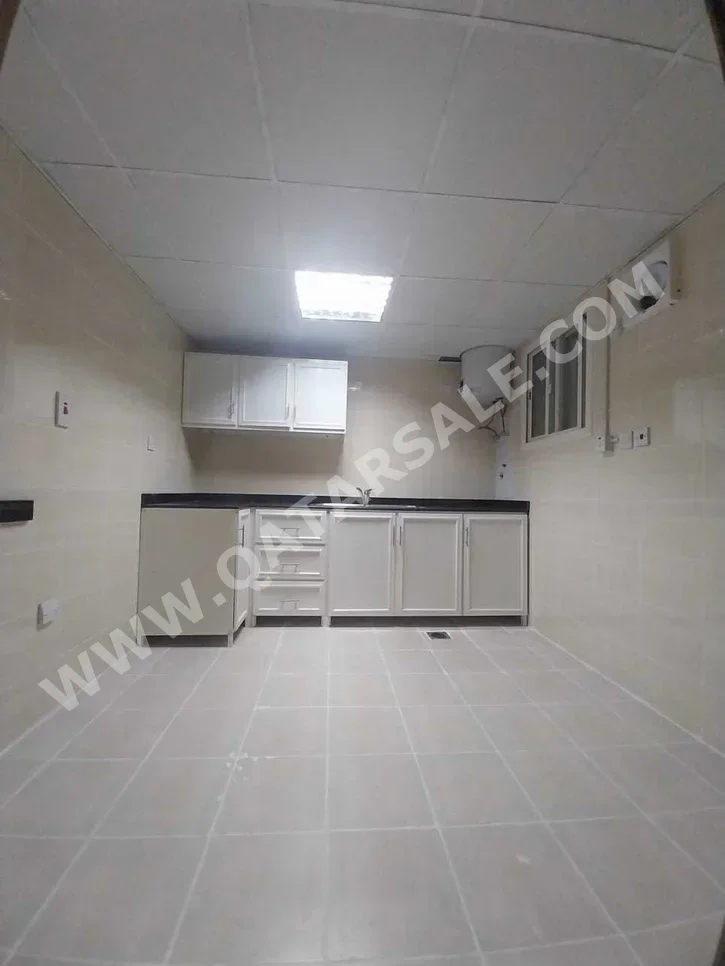 2 Bedrooms  Apartment  in Doha -  Al Mansoura  Not Furnished