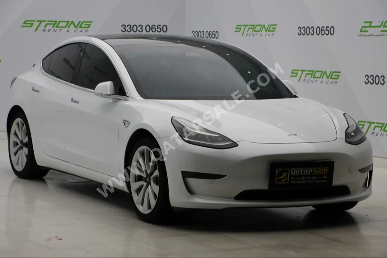 Tesla  Model 3  Long Range  2020  Automatic  96,000 Km  0 Cylinder  All Wheel Drive (AWD)  Sedan  White