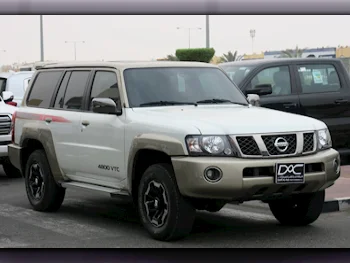 Nissan  Patrol  Super Safari  2021  Automatic  12,000 Km  6 Cylinder  Four Wheel Drive (4WD)  SUV  White  With Warranty