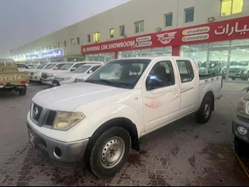 Nissan  Navara  2011  Manual  330,000 Km  4 Cylinder  Rear Wheel Drive (RWD)  Pick Up  White