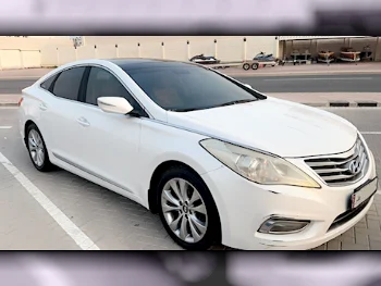  Hyundai  Azera  2015  Automatic  142,000 Km  4 Cylinder  Front Wheel Drive (FWD)  Sedan  White  With Warranty