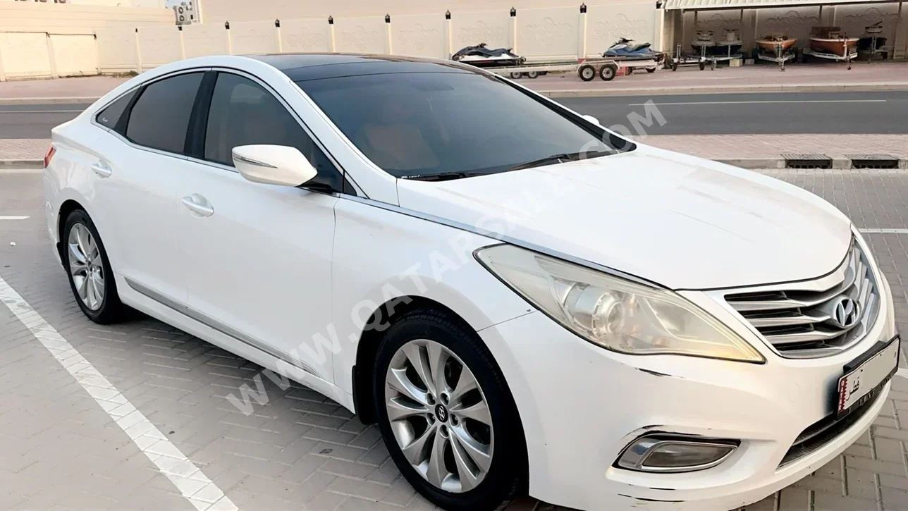  Hyundai  Azera  2015  Automatic  142,000 Km  4 Cylinder  Front Wheel Drive (FWD)  Sedan  White  With Warranty