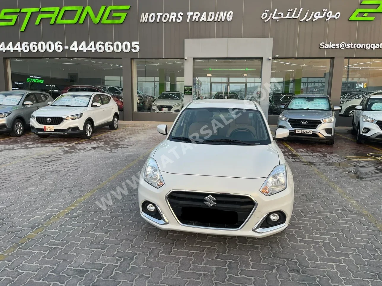 Suzuki  Dzire  2023  Automatic  85,000 Km  4 Cylinder  Front Wheel Drive (FWD)  Sedan  White  With Warranty