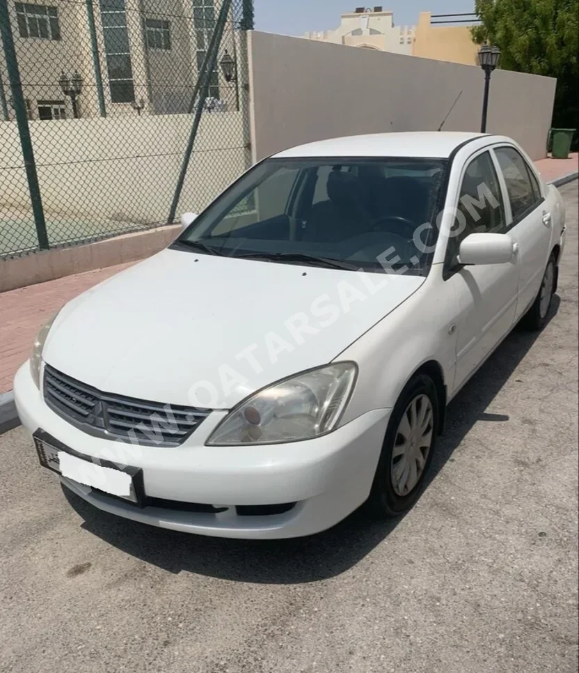 Mitsubishi  Lancer  GLS  2013  Automatic  234,000 Km  4 Cylinder  Front Wheel Drive (FWD)  Sedan  White