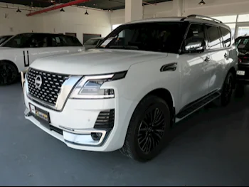 Nissan  Patrol  Platinum  2023  Automatic  11,000 Km  6 Cylinder  Four Wheel Drive (4WD)  SUV  White  With Warranty