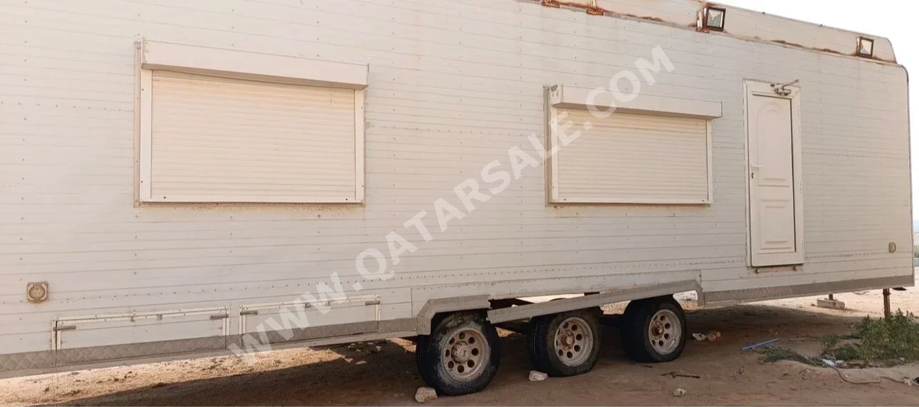 Caravan - 2013  - White  -Made in Qatar