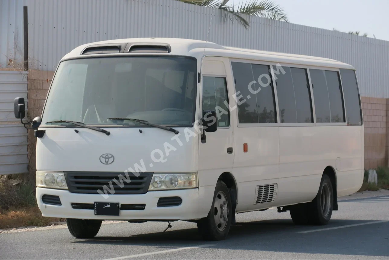 Toyota  Coaster  2014  Manual  180,000 Km  4 Cylinder  Rear Wheel Drive (RWD)  Van / Bus  White